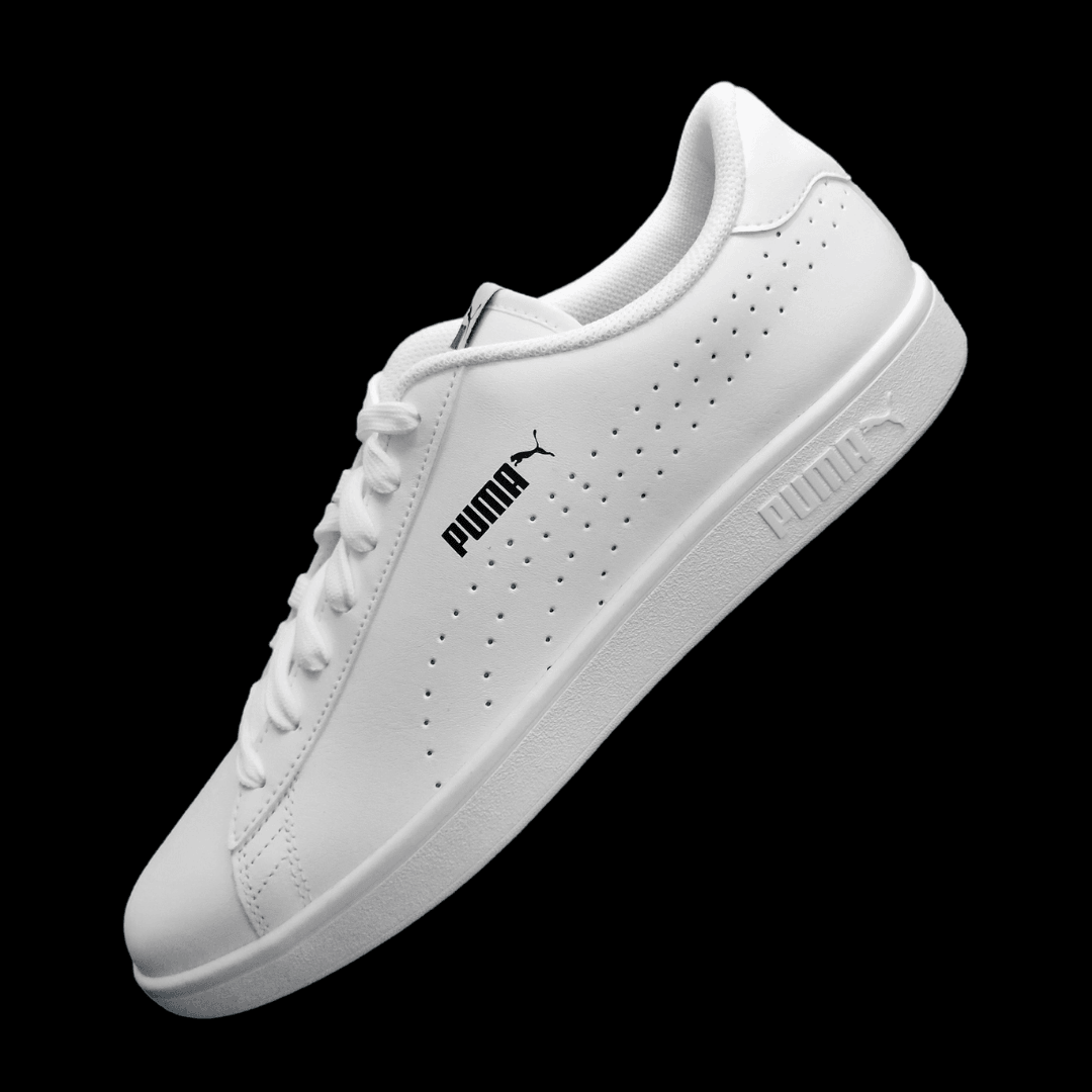 A Puma product photo on a black background, created with the Background Changer.