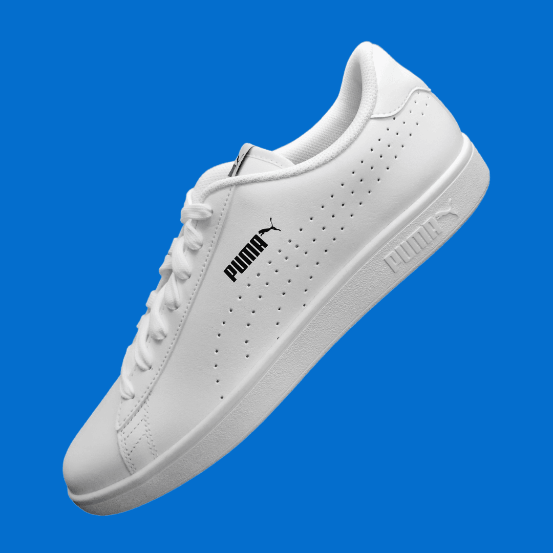 A Puma product photo on a blue background, created with the Background Changer.