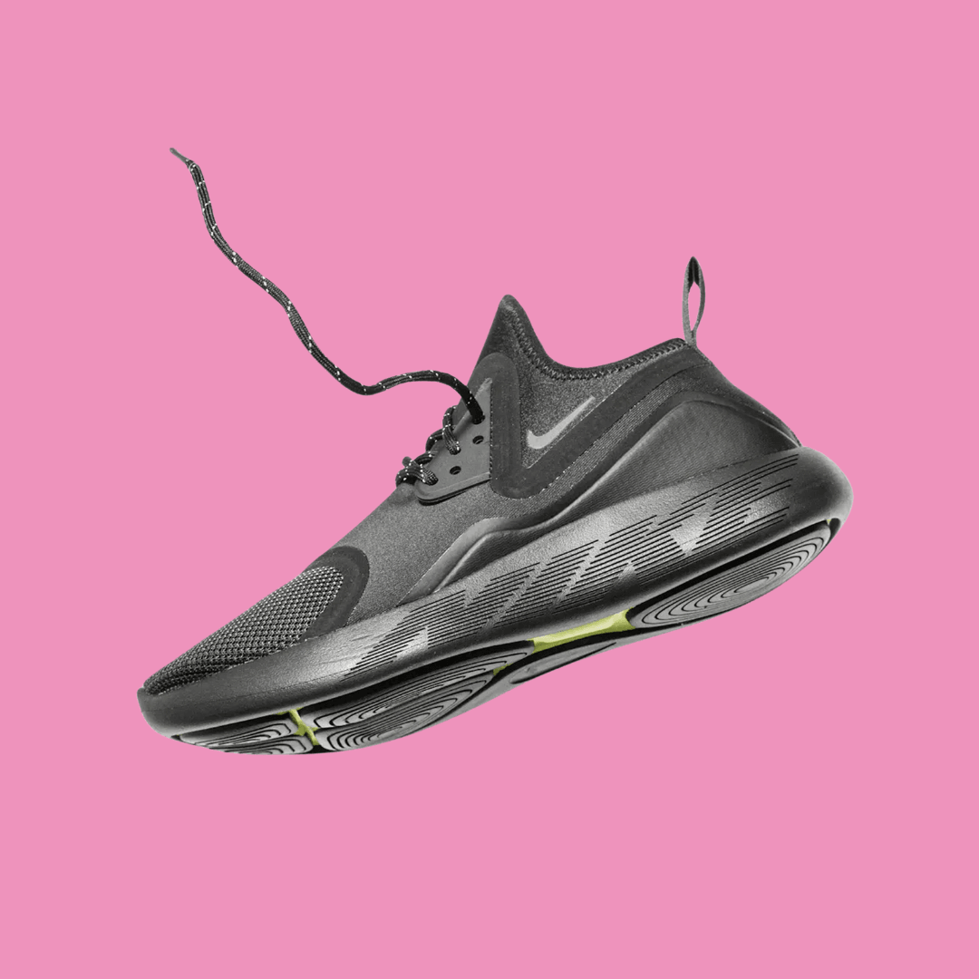 A Nike product photo on a pink background, created with the Background Changer.